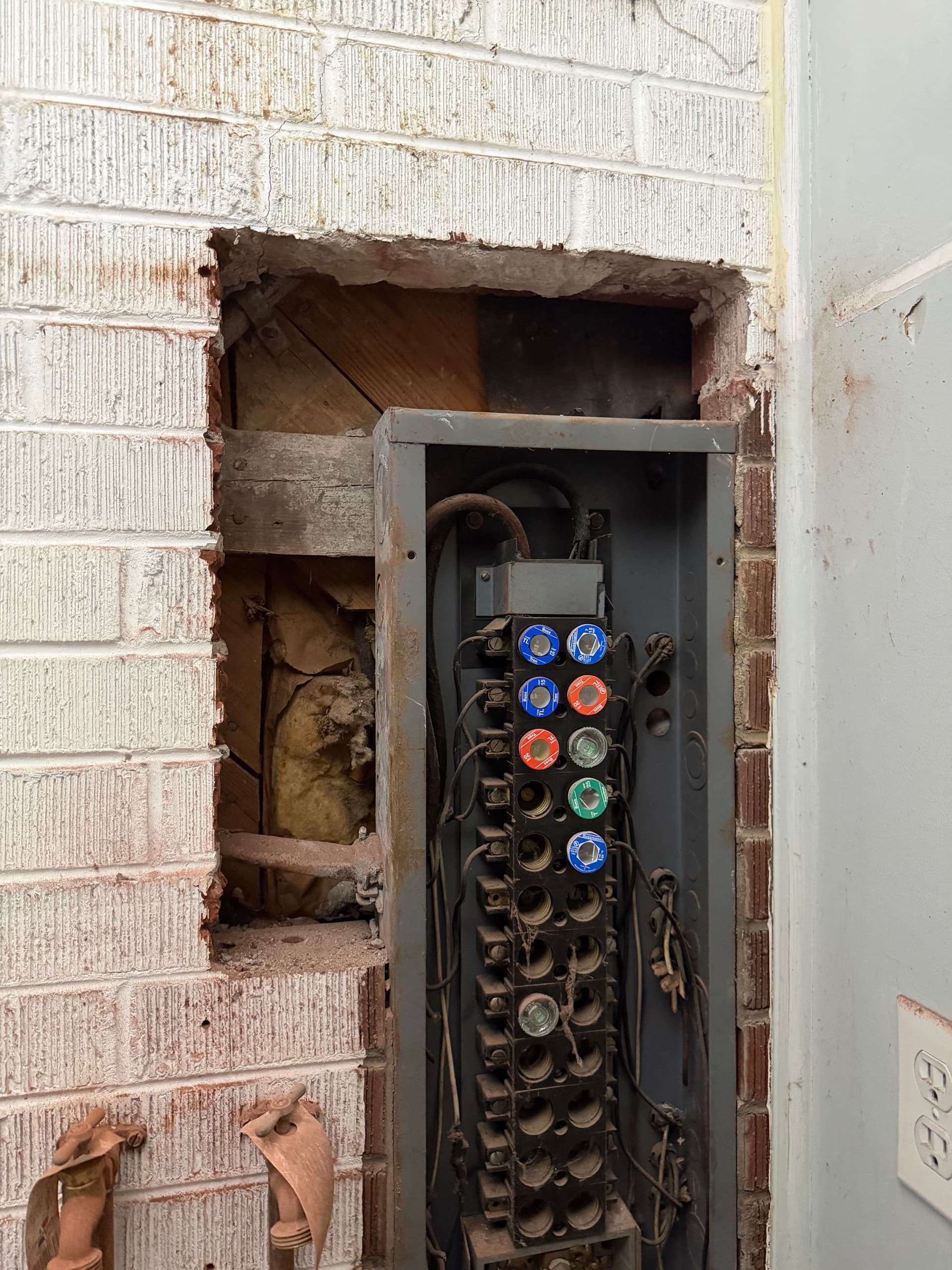 Old Fuse Panel Replaced With a Modern Breaker Panel image