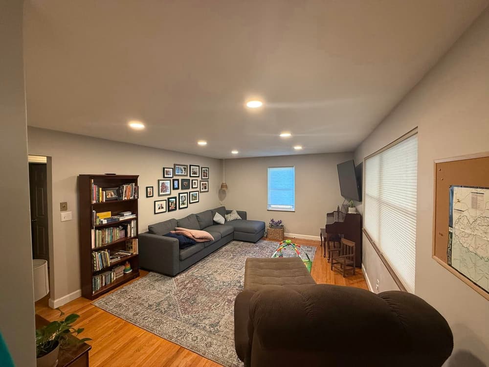 Wood ceiling with recessed lighting and ceiling fan in a covered outdoor patio.